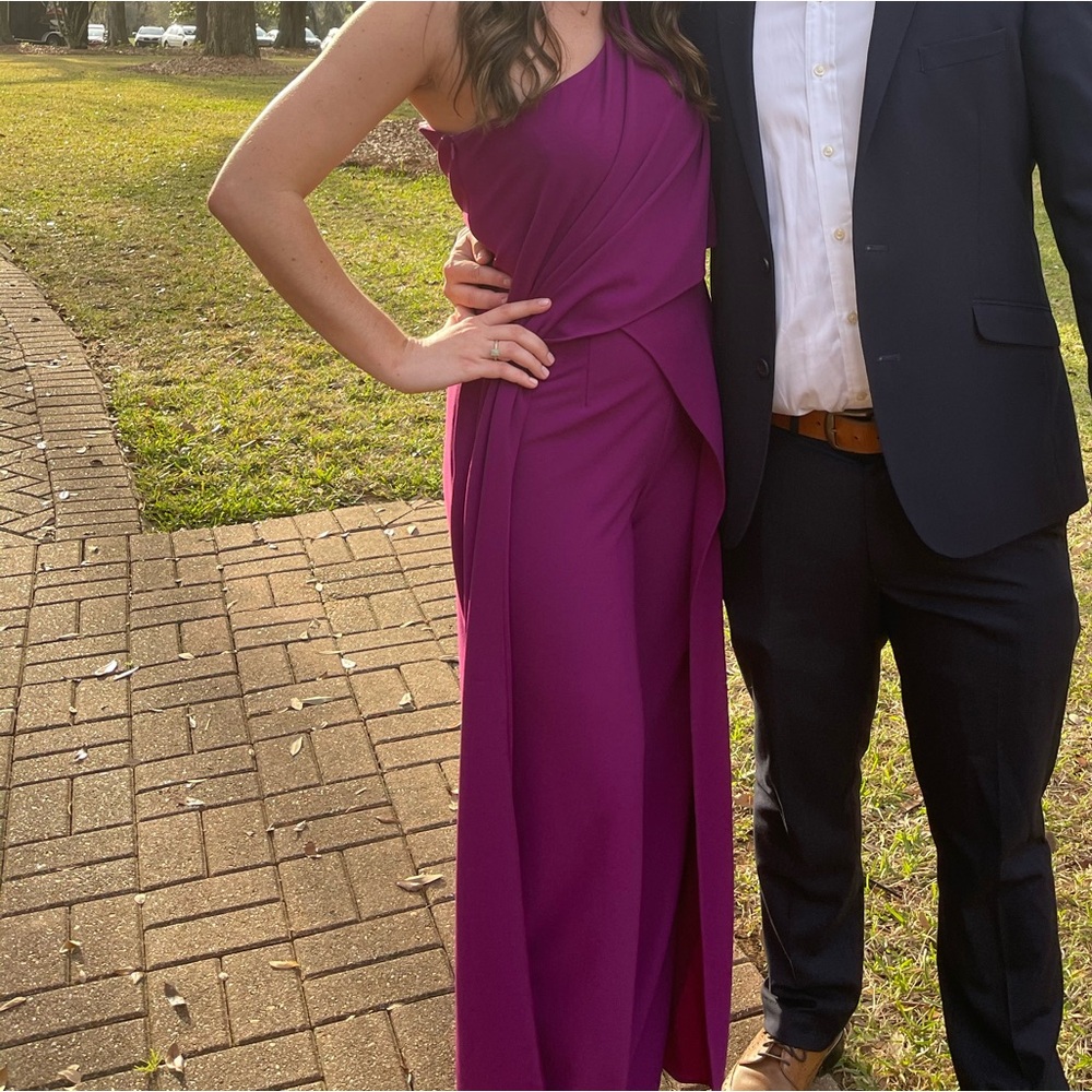 One shoulder purple jumpsuit.